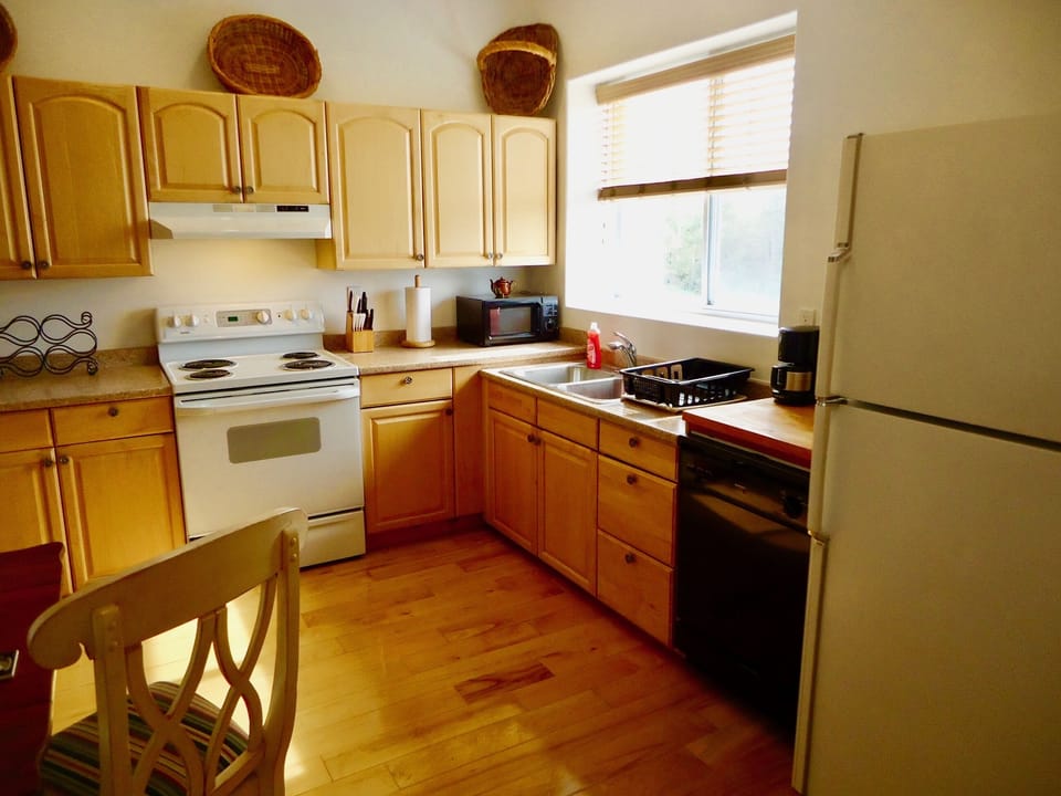 Kitchen looking east to sunrise over the bay.