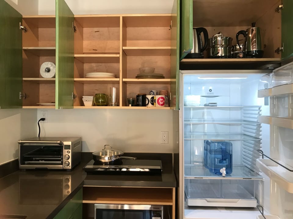 Spacious kitchen storage with full sized refrigerator
