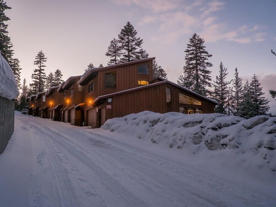 Winter. Corner unit with floor to ceiling windows. Trail to Canyon lodge at top.