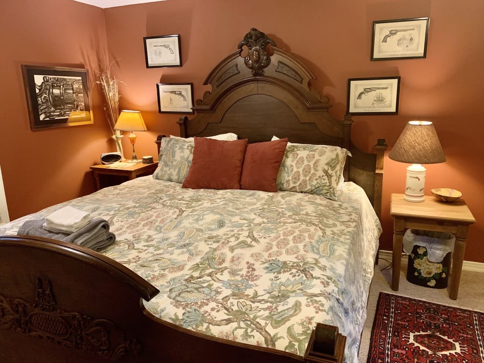 Downstairs King Bedroom with side walk outside door. 