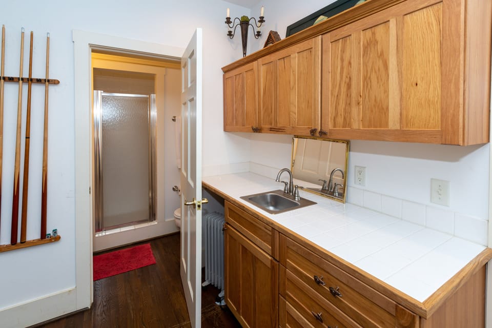 Wet bar area with small refrigerator