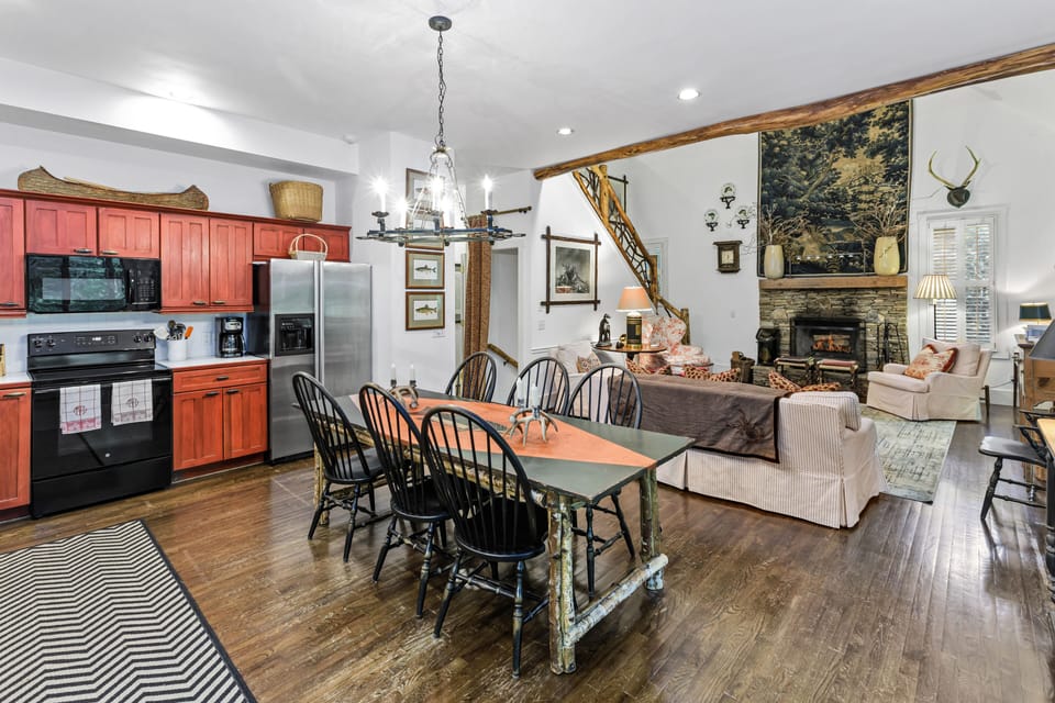 Open kitchen concept with dining table and chairs for 8