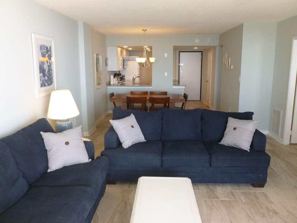 Living room with new porcelain tile floors.