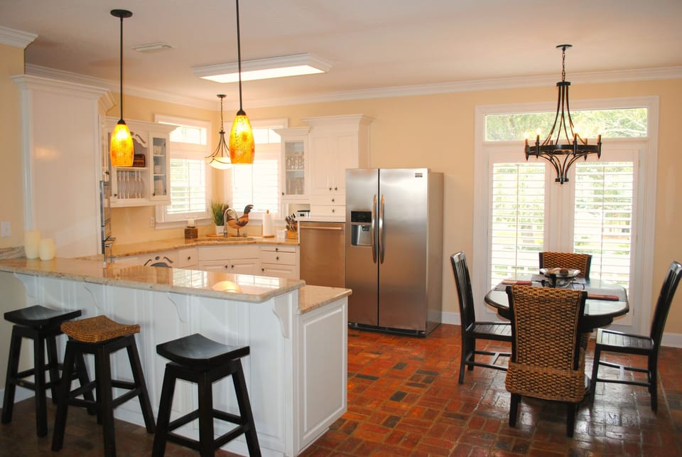 Dining area seats four. Bar top seats three.