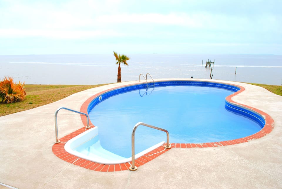 Newly re-done pool with beautiful views of the Gulf! Come Relax!