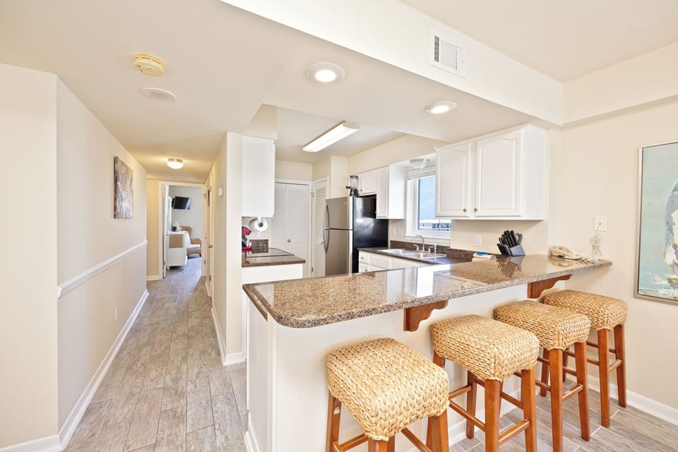 bar seats and kitchen