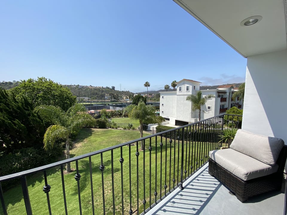 View of golf course and tennis courts from private balcony 
