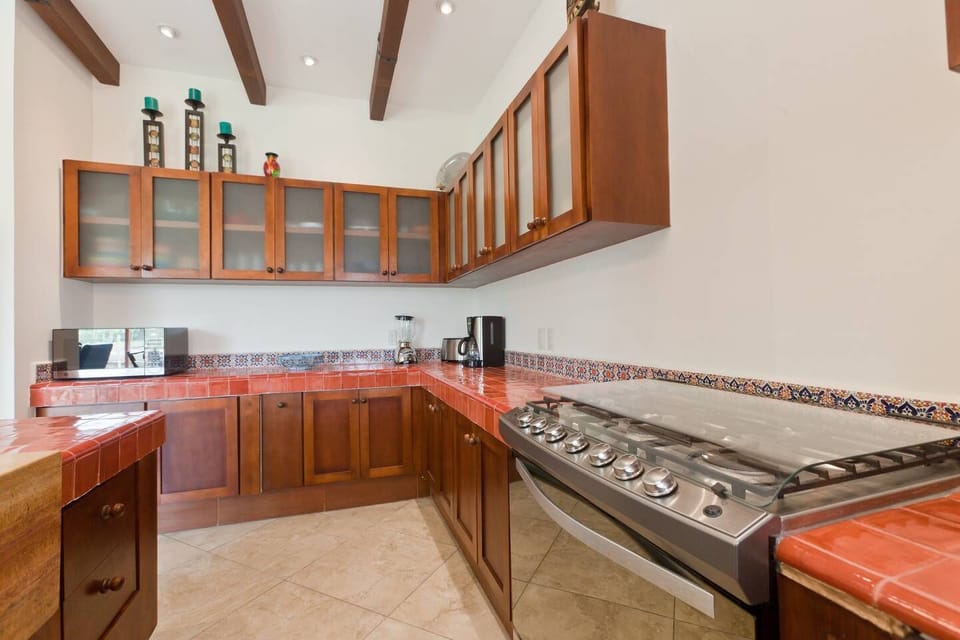 Kitchen with lots of storage and 6 burner stove and full size oven