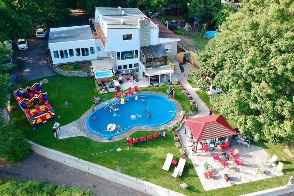 A drone view showcasing the villa, pool, and expansive outdoor spaces.