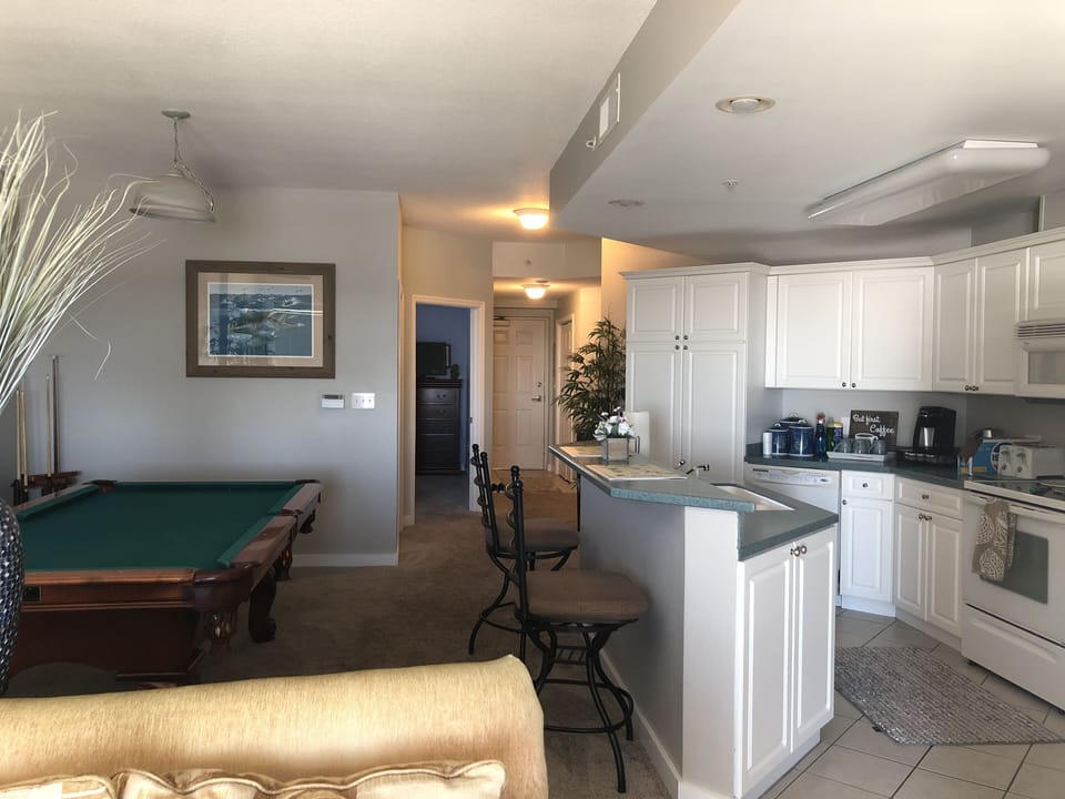 Balcony view of the Kitchen and pool table 
