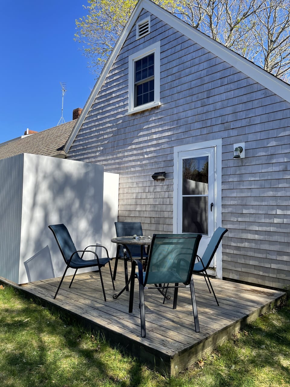Back deck with enclosed outside shower. 