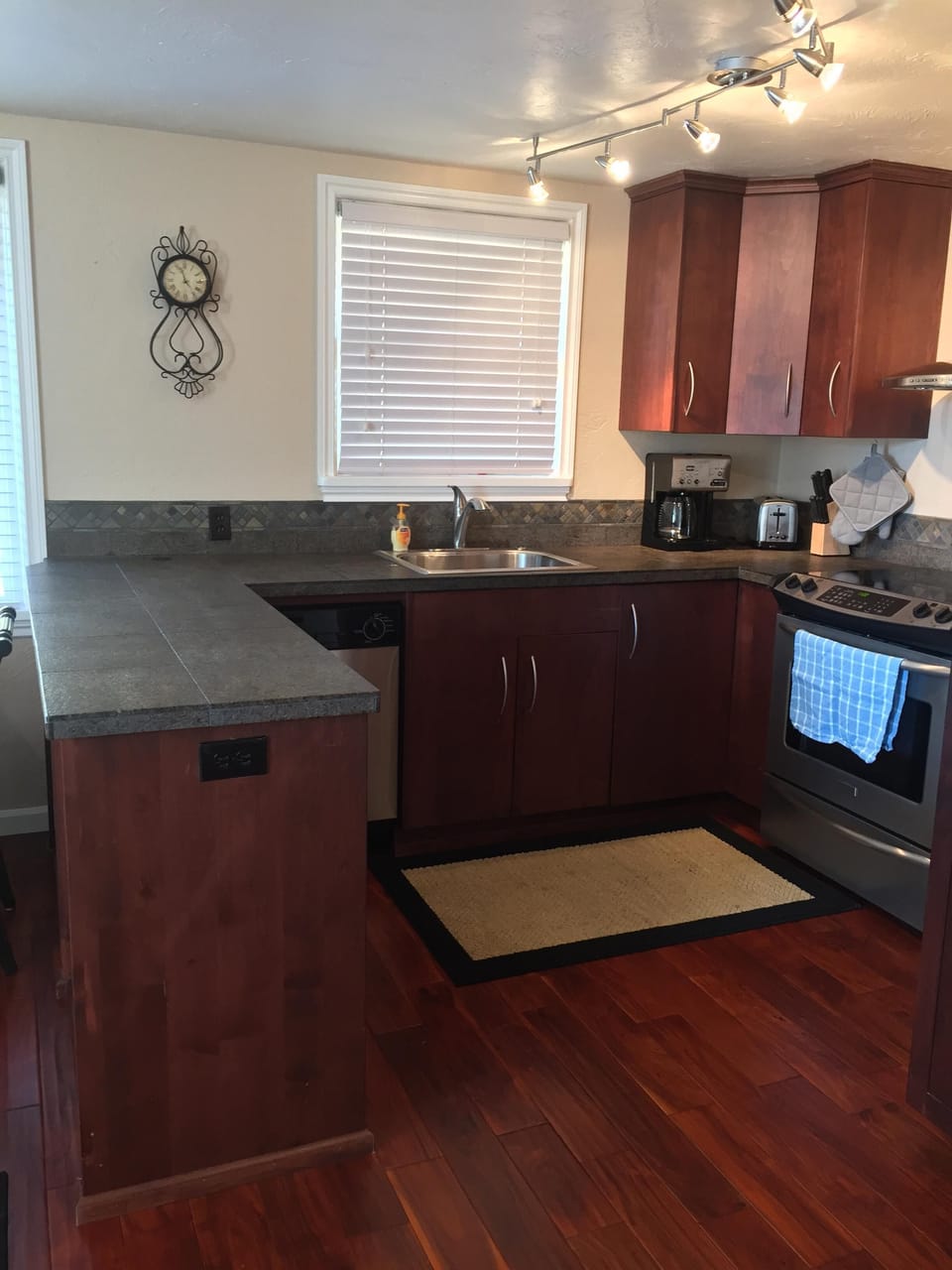 Full kitchen with dishwasher.