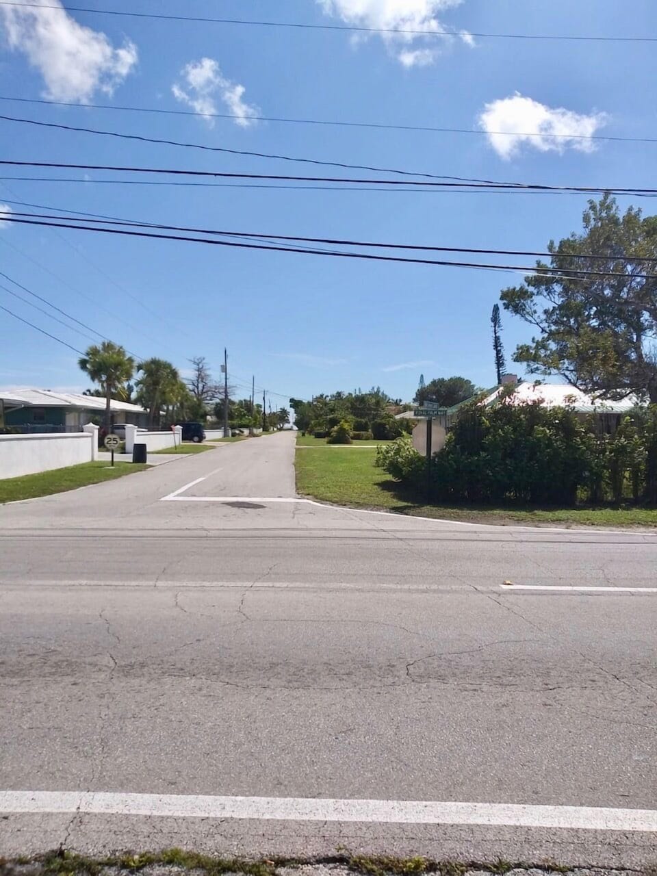 The beach is at the end of this street from the house