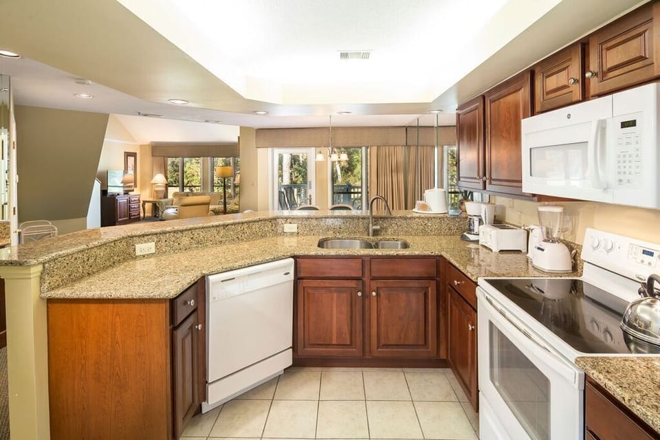 Fully equipped Kitchen with access to a large size washer and dryer. 