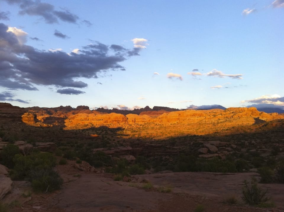 Sun on rim from trail known as 'Behind the rocks' famous to off roaders, bikers.