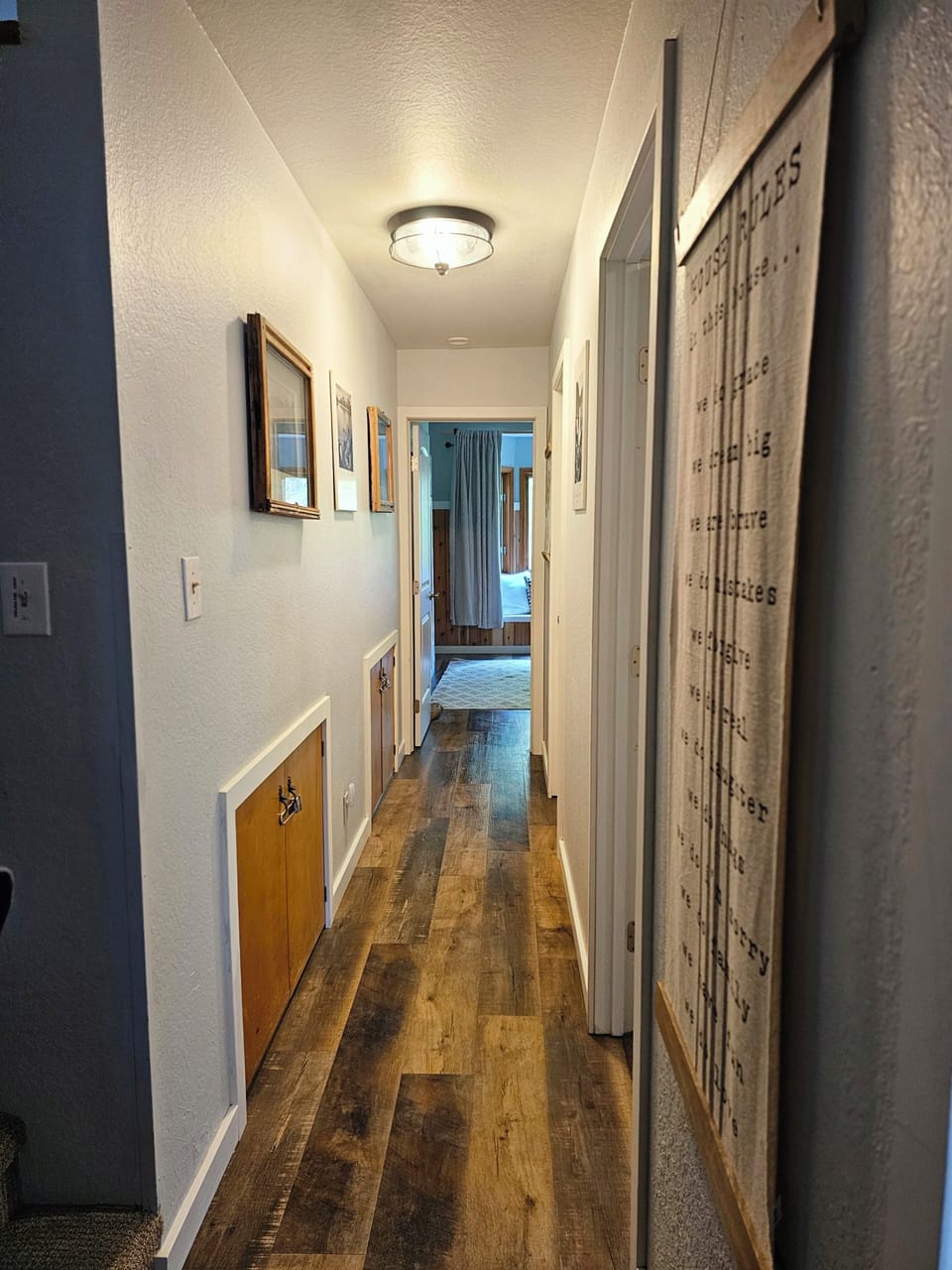 hall to main floor, 2 bedrooms, bathroom, laundry room and exterior door