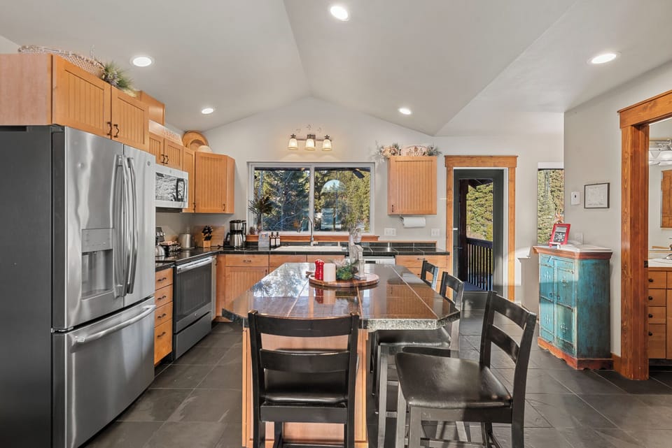 Upstairs kitchen with connected deck and large table for warmer months 