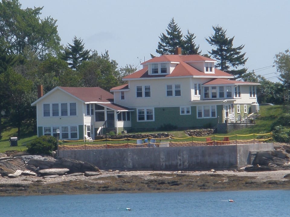 Back of house from water. Green part of lower level is guest cottage