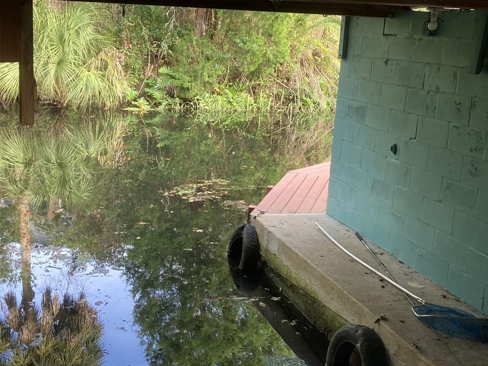 Water walkway from inside boathouse to side yard dock. 