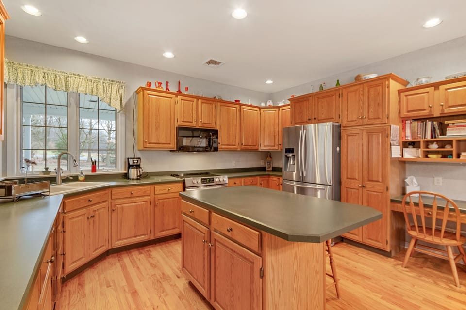 Large, well-stocked kitchen with modern appliances.