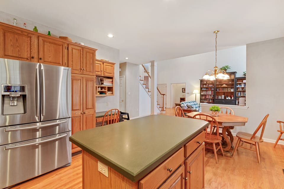 Large, open kitchen with ample seating. Large refrigerator with ice maker.