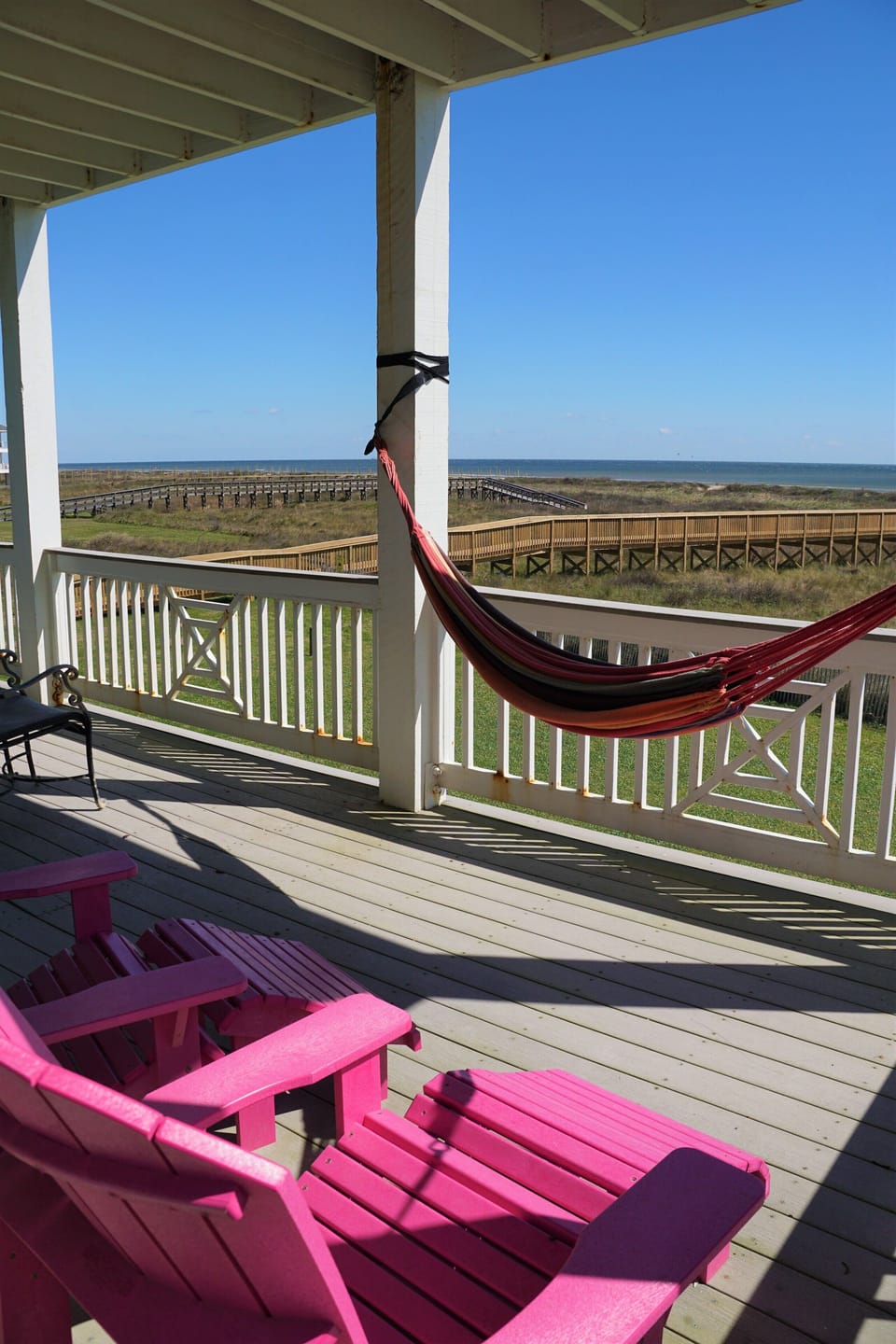 The balcony off of the master bedroom has a hammock and comfortable seating.