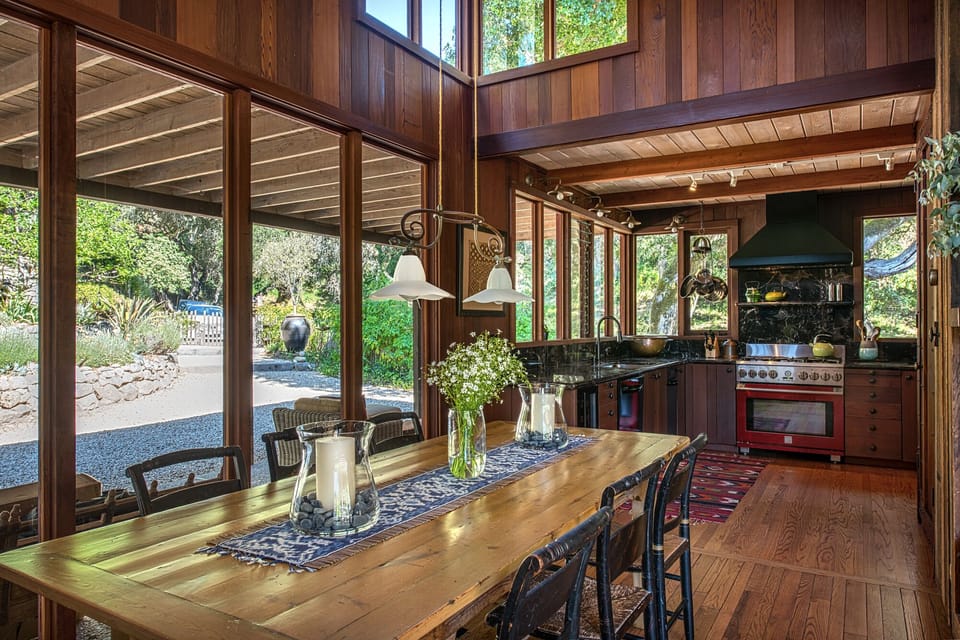 The comfortable dining area is open and has abundant light and views. Seats 8.