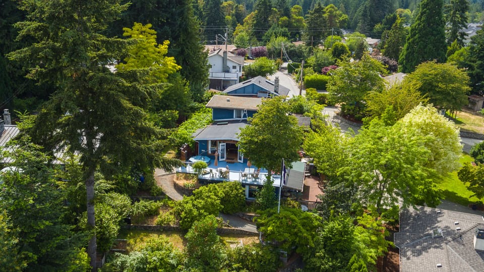 Main house amongst trees to give Waterlily privacy.  Huge deck overlooks lake.