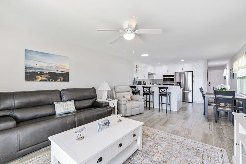 Living Room Opens Up to Breakfast Bar and Kitchen