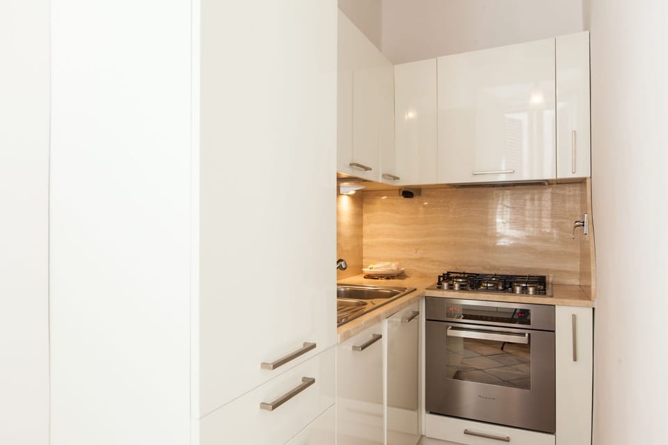 The kitchen is fully equipped with oven and dishwasher