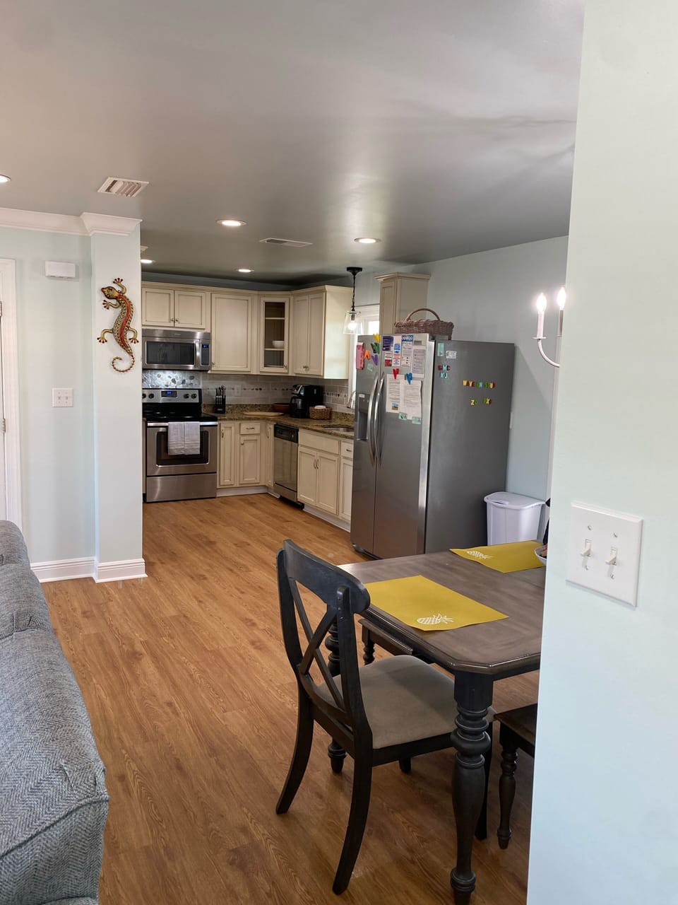 Kitchen, dining, living room all open out onto the screened porch