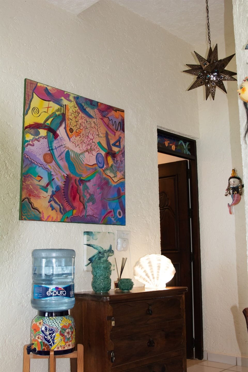 The hall with it's contemporary painting and hand tooled star light fixture
