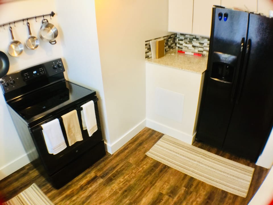 Full Kitchen with full size Fridge/freezer and stove