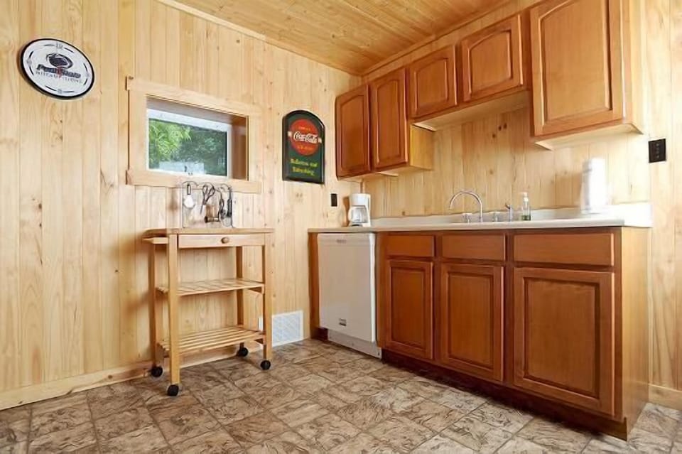 Right hand side of kitchen. all plates, pots and pans, are included.