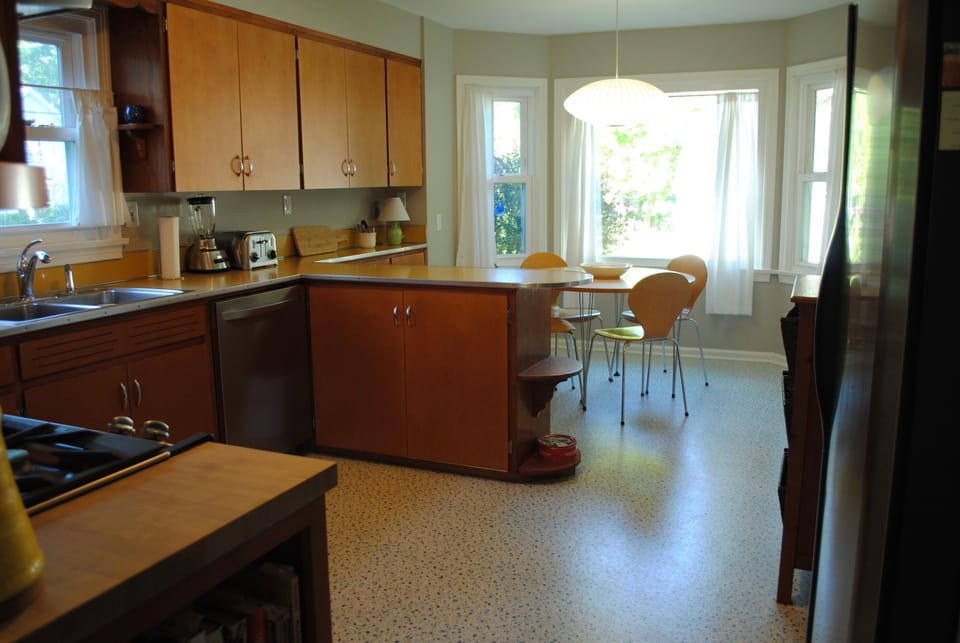 The kitchen looks out on the backyard