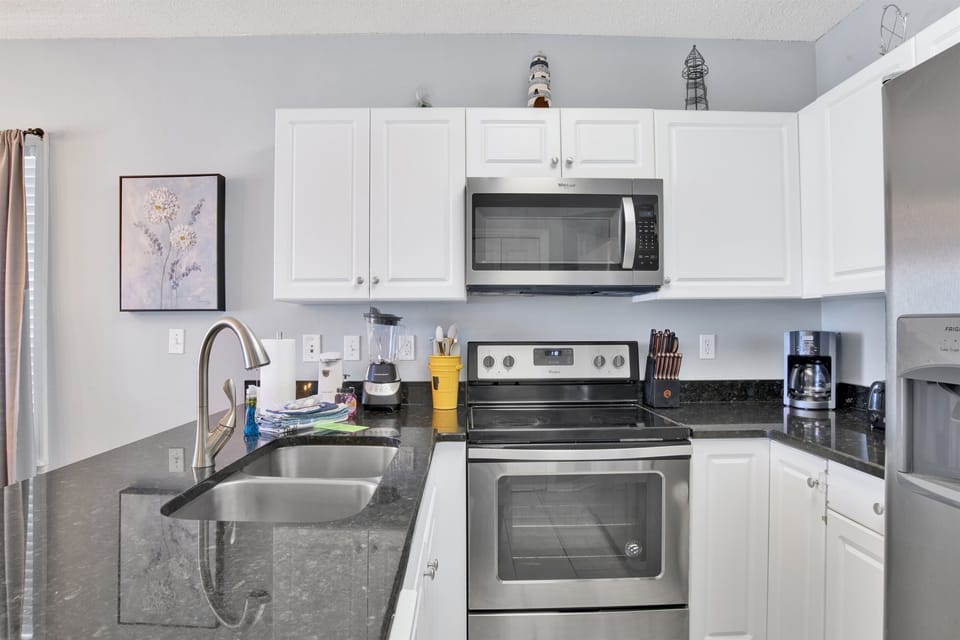 Kitchen with granite countertops and stainless steel appliances