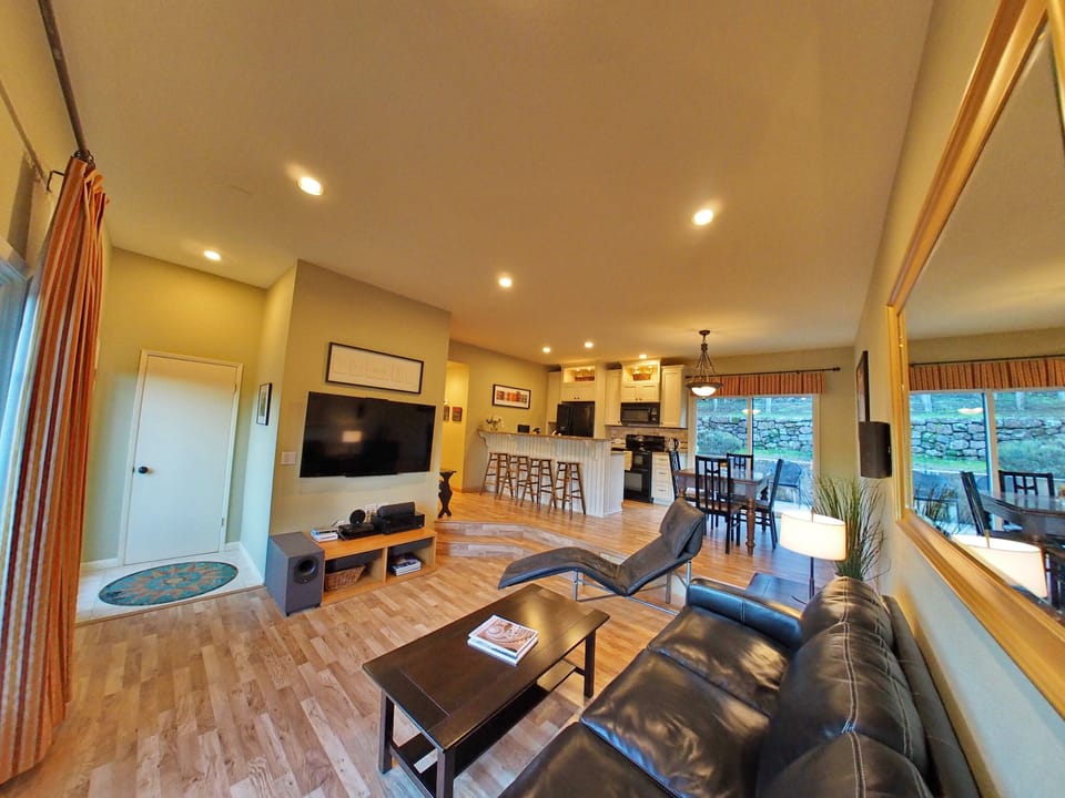 Open floor plan among entry, living room, kitchen and dining area