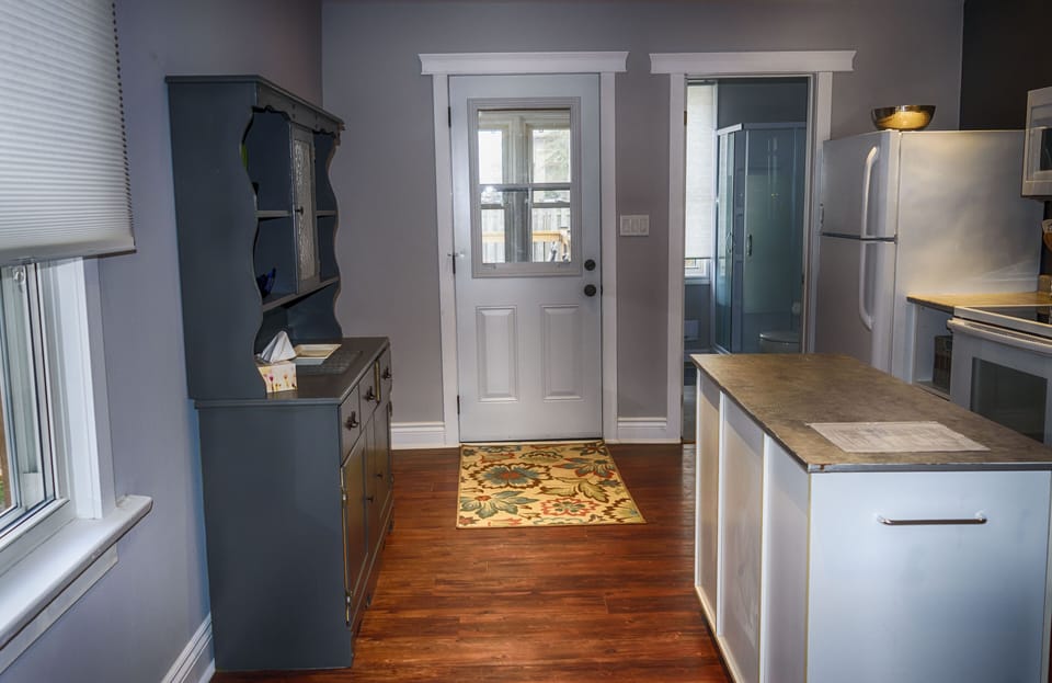 Mud room off kitchen to backyard. Three piece washrooms off kitchen
