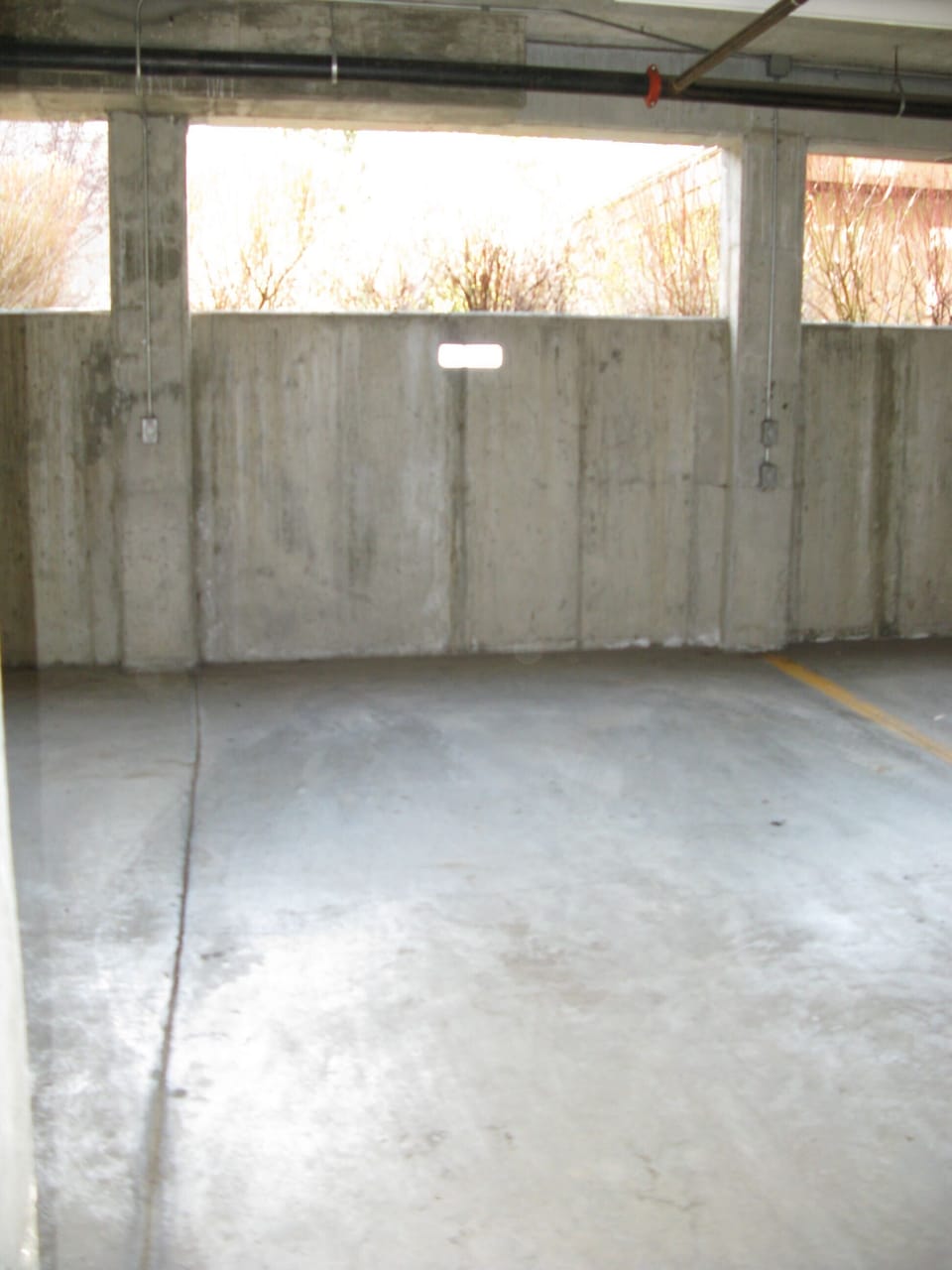 Covered Parking Garage with One assigned spot. There is guest parking. 