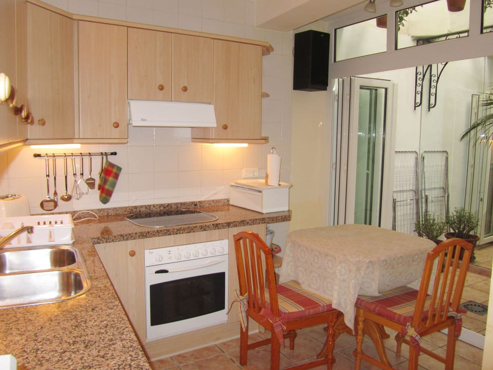 Casa Charlotte Ground or Bottom floor with dining corner and a small patio.