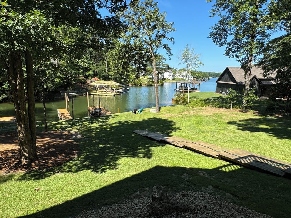 Easy lake access and gorgeous view with large, useable backyard and sunsets!