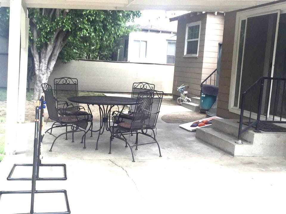 Backyard with outside seating and Charcoal BBQ