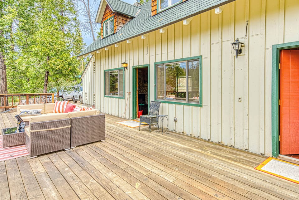1000 Square Foot Deck and Front Door leading to Living Room and Fifth Bedroom