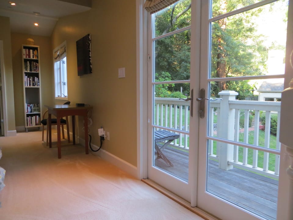 French doors to deck! Desk and bookshelves. 