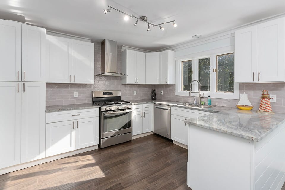 Large and bright kitchen, stainless appliances, gas range