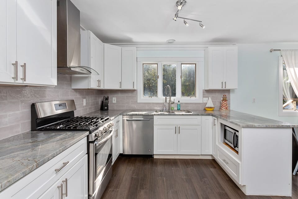 Large and bright kitchen, stainless appliances, gas range
