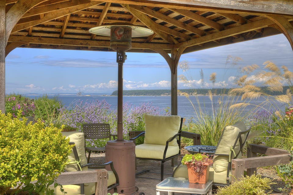 Relax in the gazebo with propane heater and four comfortable chairs.