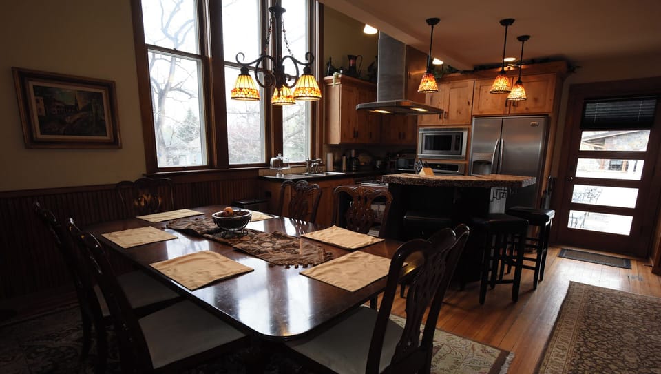 Kitchen and dining area. Door leads to courtyard.