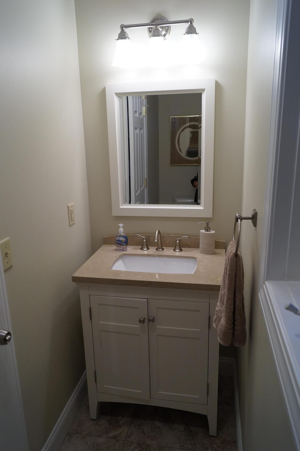 1/2 Bath off the Kitchen 1st Floor.