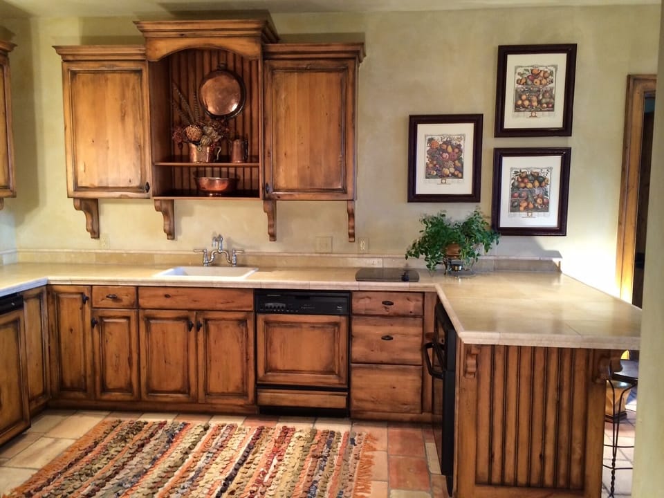 Kitchen area. Range, dishwasher, small fridge, oven, standard kitchen amenities